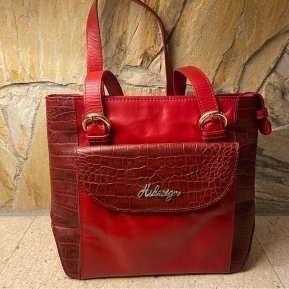 Hidesign genuine leather and hand crafted handbag in a rich red shade